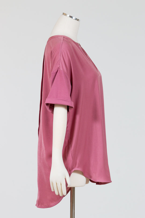 LYSSÉ's Leah Short Sleeve Top is an oversized satin shirt that flows over the body the sleeves are short and cuffed and are made in a contrasting jersey knit fabric for comfort.