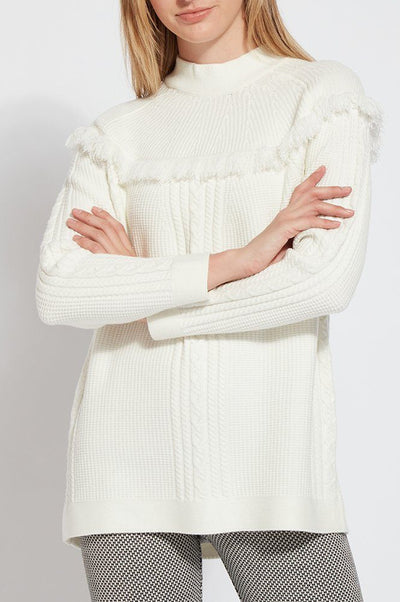 LYSSÉ Getaway Sweater is cable knit with a funnel neck and fringe accents it is stretchy and comfortable and so easy to wear to give your outfit a real dose of style. 