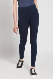 LYSSÉ Denim Legging  is a full length high waist stretch denim knit legging with a concealed inner waistband made in a polyester blend that lends to a very slimming fit that hugs the body.